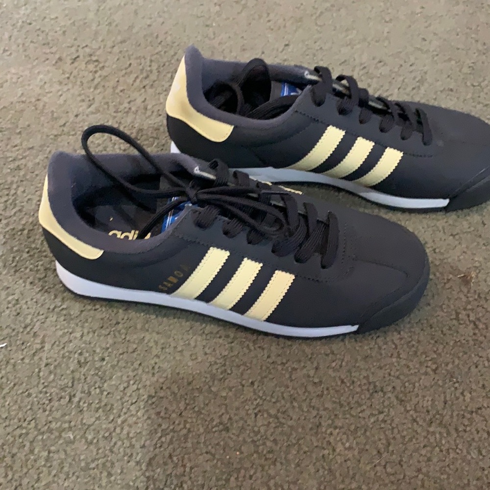 Dark grey NEW Adidas sneakers. Super cute with light yellow accents.